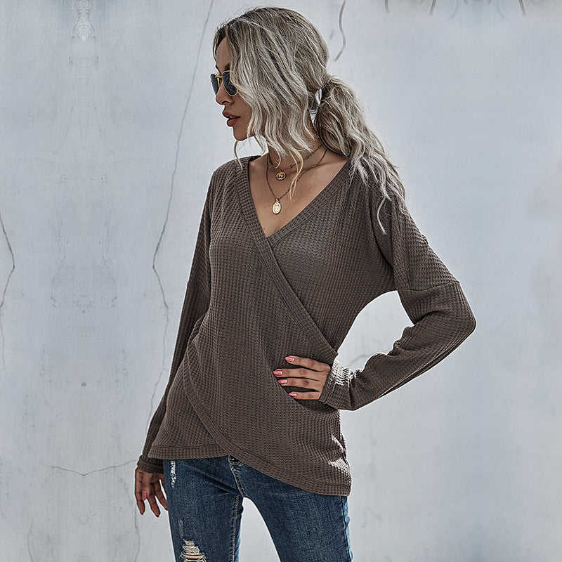 Woman in taupe waffle knit wrap sweater and distressed jeans, stylish casual fashion by FashionRay