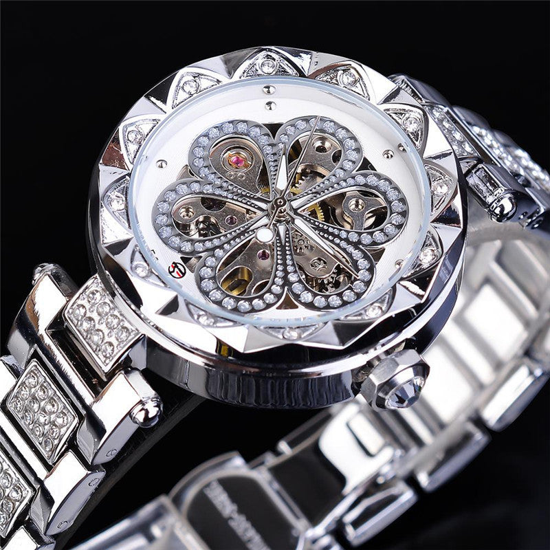 Elegant silver women’s watch with crystal-studded bracelet and floral skeleton dial by FashionRay