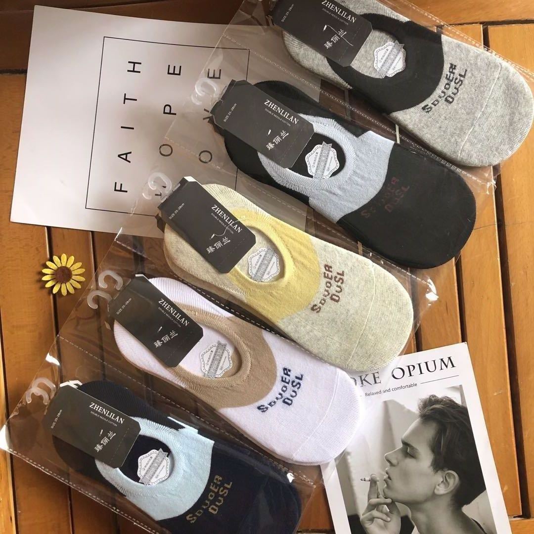 Five pairs of colorful low-cut socks in packaging on a wooden surface, FashionRay style