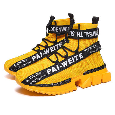 Bold yellow chunky sneakers with black text details, trendy streetwear from FashionRay