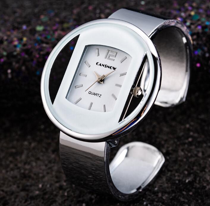 Modern silver oval wristwatch with white face, FashionRay trendy accessory on dark background
