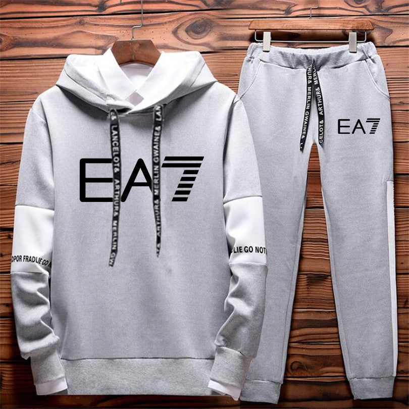 FashionRay light grey EA7 tracksuit with hoodie and joggers, displayed on wooden background