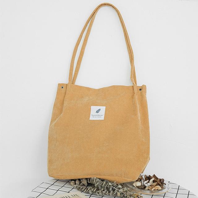 Mustard yellow corduroy tote bag with long straps, FashionRay modern accessory on white background