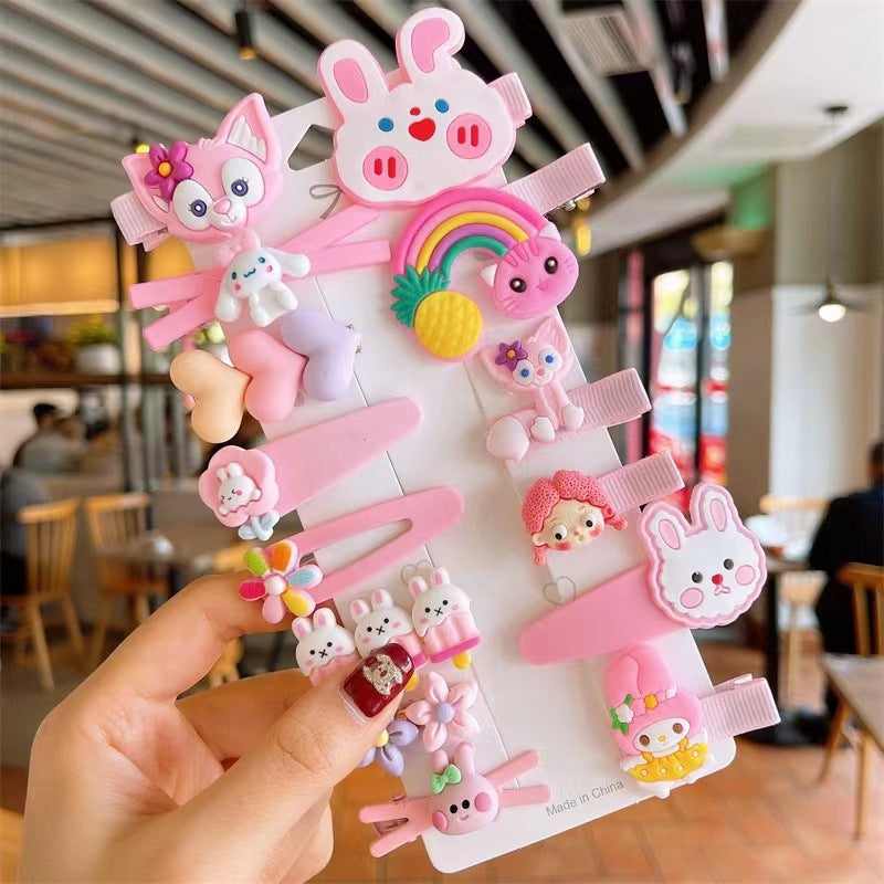 FashionRay cute pink hair clips set with animal, rainbow, and flower designs, held in café.