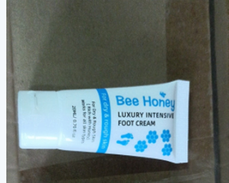 Bee Honey luxury intensive foot cream tube for dry skin on a brown surface at FashionRay