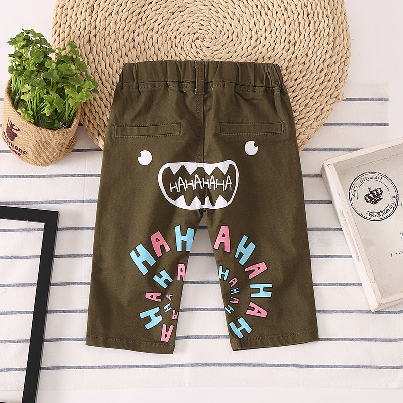 Kids' olive green shorts with playful monster face and 'HAHAHA' print, FashionRay style