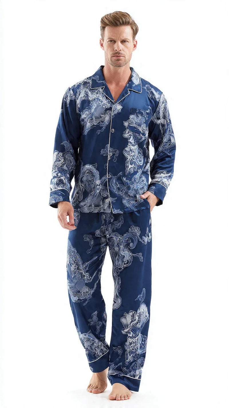 Man modeling navy blue satin men's pajamas with white floral pattern from FashionRay