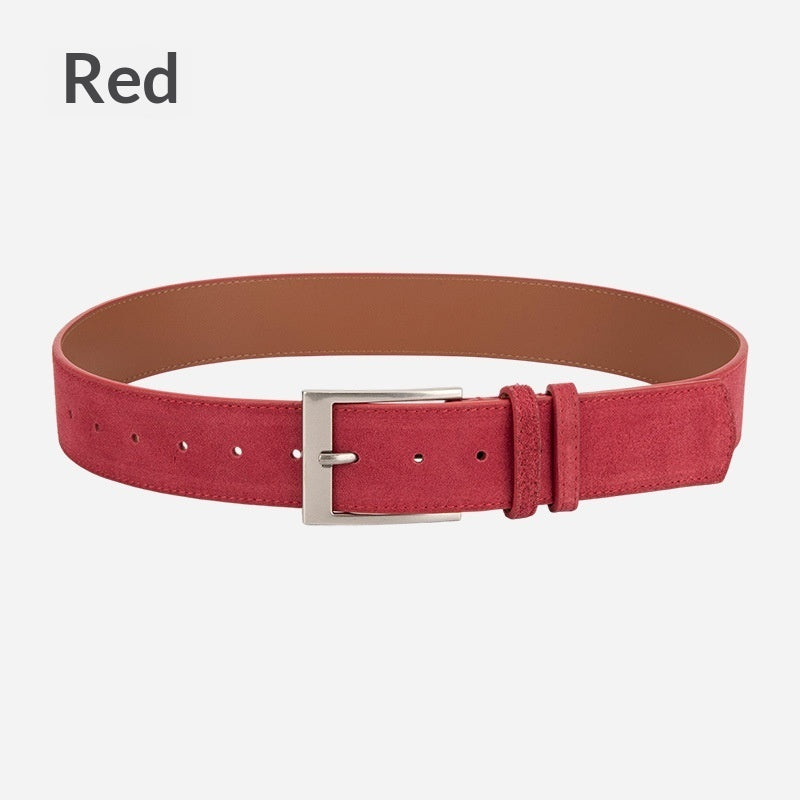 Red suede fashion belt with silver buckle on white background