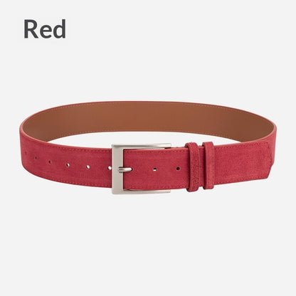 Red suede fashion belt with silver buckle on white background