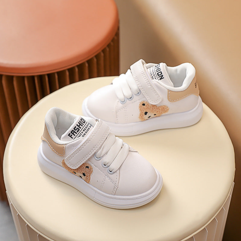 FashionRay kids’ white sneakers with bear patch and velcro strap on neutral background