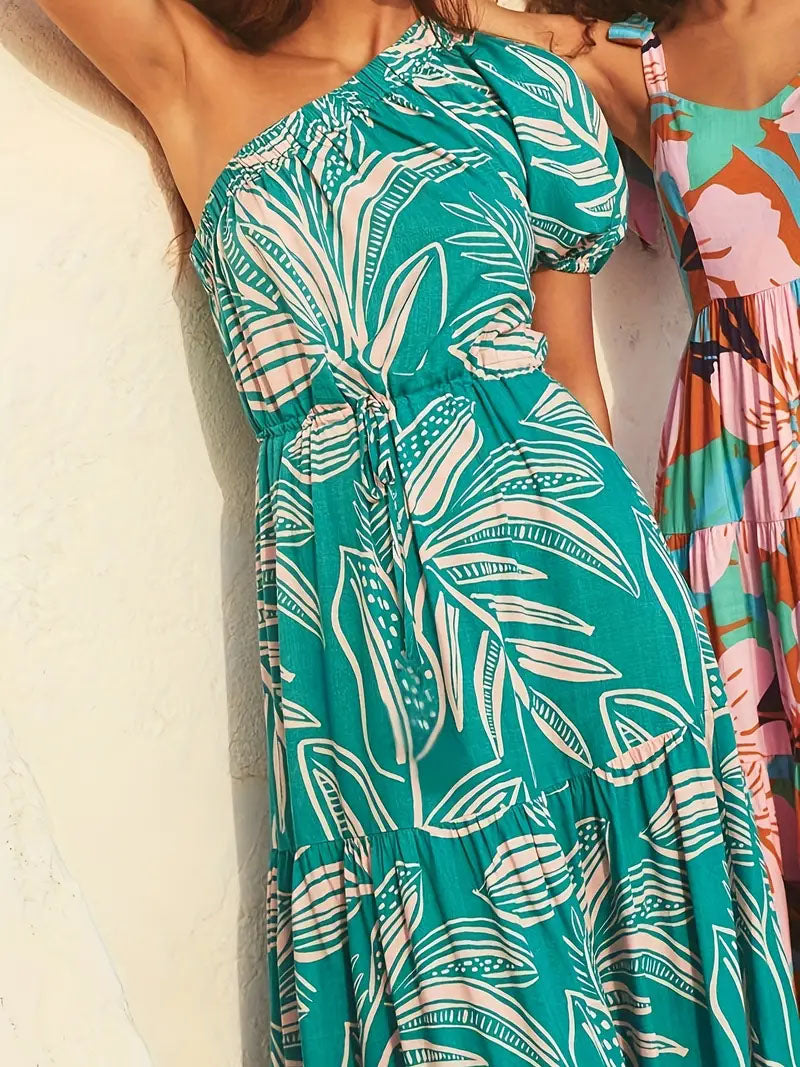 Woman wearing a green one-shoulder tropical print dress, summer fashion from FashionRay