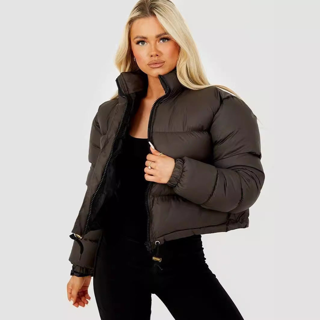 Woman modeling a stylish black puffer jacket from FashionRay against a plain background