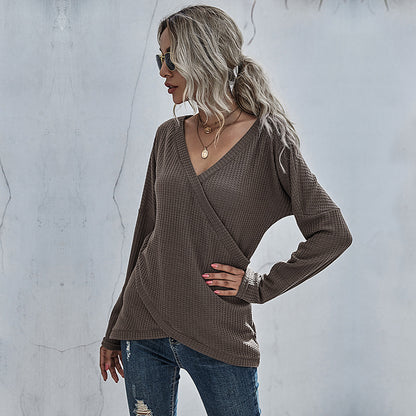 Woman in taupe waffle knit wrap sweater and distressed jeans, stylish casual fashion by FashionRay