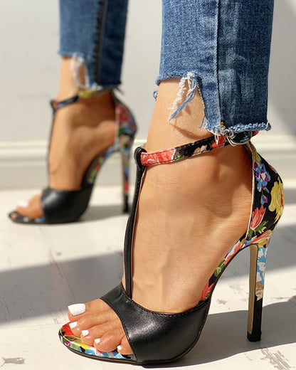 Woman wearing floral high heel sandals and frayed hem jeans, FashionRay trendy footwear
