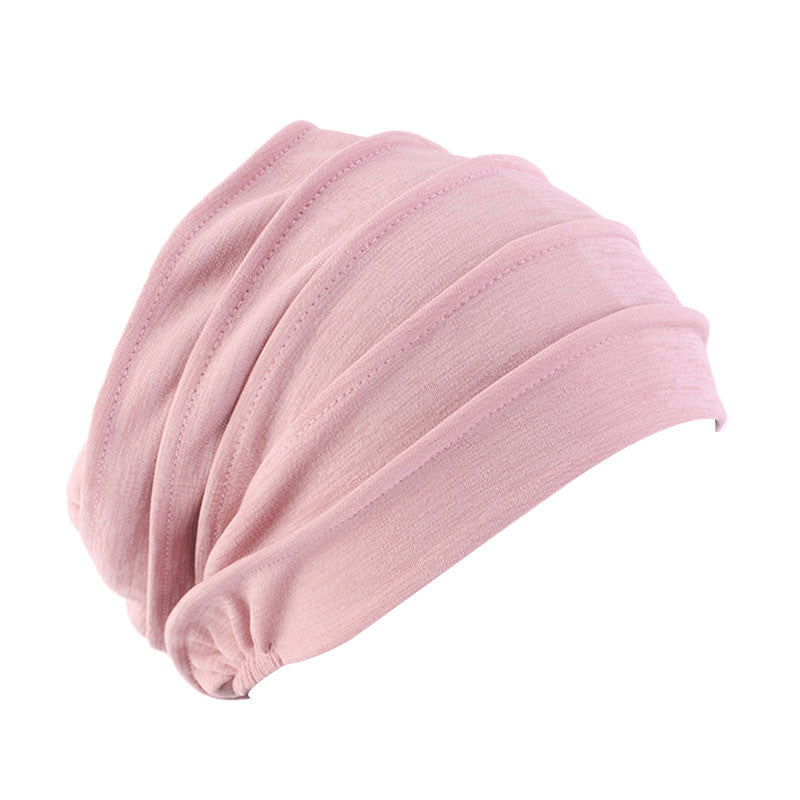 Soft pink ruched turban hat, stylish and comfortable headwear from FashionRay