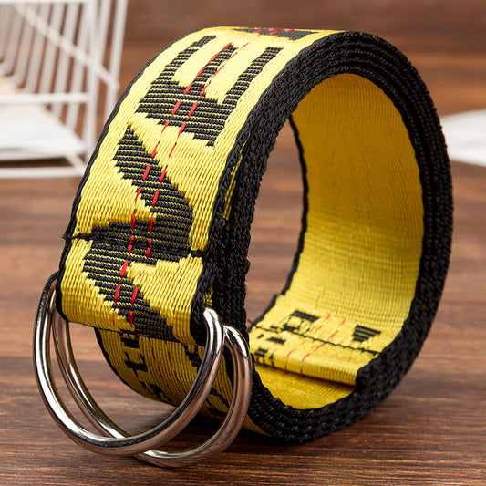 Yellow and black fashion belt with metal D-rings on wood surface, bold street style accessory