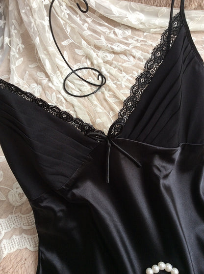 Black satin slip dress with lace trim and pearl accent on lace fabric, FashionRay style