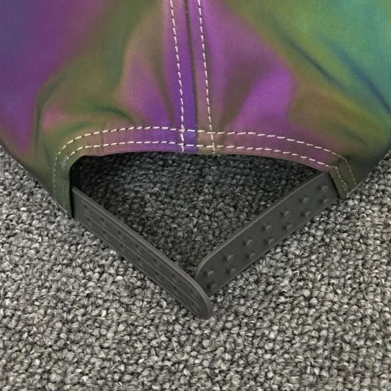 Iridescent adjustable snapback cap on gray textured carpet, FashionRay trendy accessory