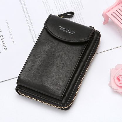 Black leather wallet with zipper and snap, styled on white desk at FashionRay