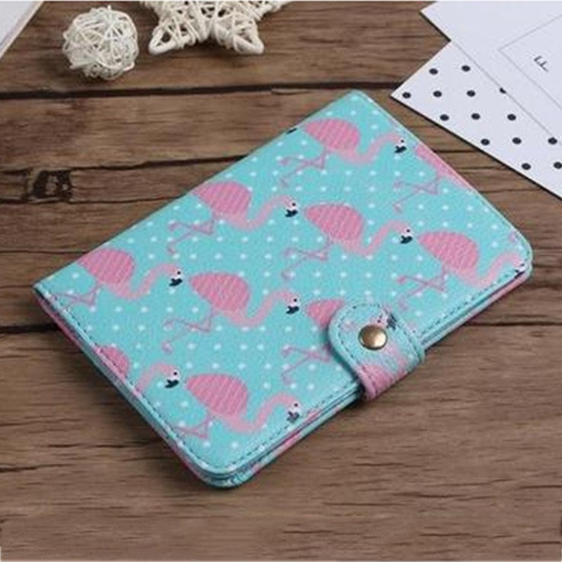 Blue wallet with pink flamingo print on wooden table, trendy FashionRay accessory