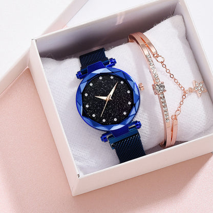 Elegant blue watch with glittery black face and rose gold bracelet with crystals in gift box