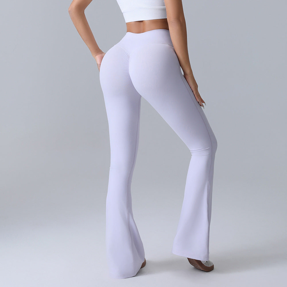 Woman wearing high-waisted, white flared leggings and a crop top, FashionRay studio style