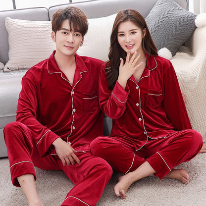Couple wearing matching red velvet pajamas on sofa, FashionRay cozy loungewear set