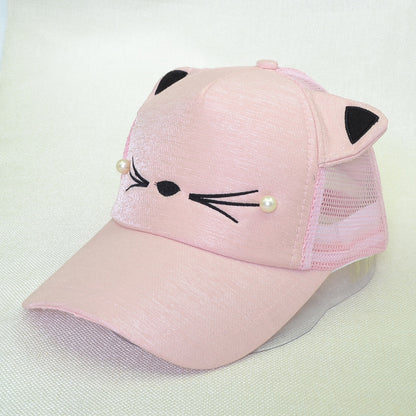 Pink cat face trucker hat with mesh panels, pearl whiskers, and embroidered details