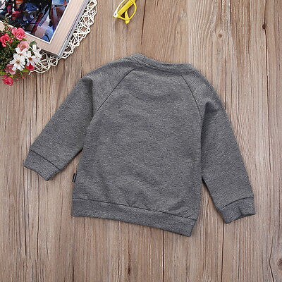 Gray long-sleeve sweatshirt on wood, FashionRay trendy kids casual wear flat lay