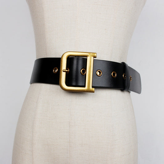 Wide black leather belt with bold gold buckle on mannequin, FashionRay trendy accessory