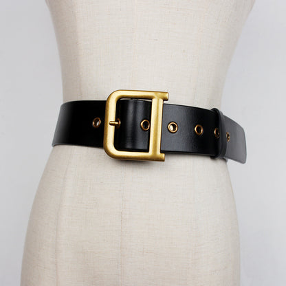 Wide black leather belt with gold buckle on mannequin, FashionRay trendy accessory