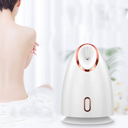 Woman in spa setting with white facial steamer device, showcasing self-care and skincare
