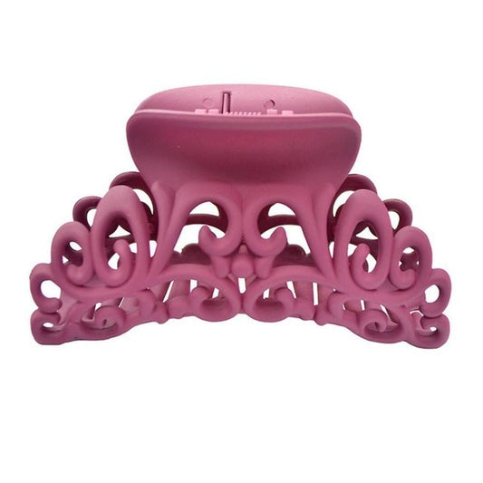 Ornate pink matte hair claw clip with scroll design, fashionable accessory at FashionRay