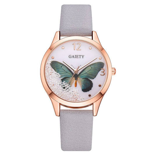 Rose gold watch with blue butterfly dial, crystal accents, and light grey strap, FashionRay