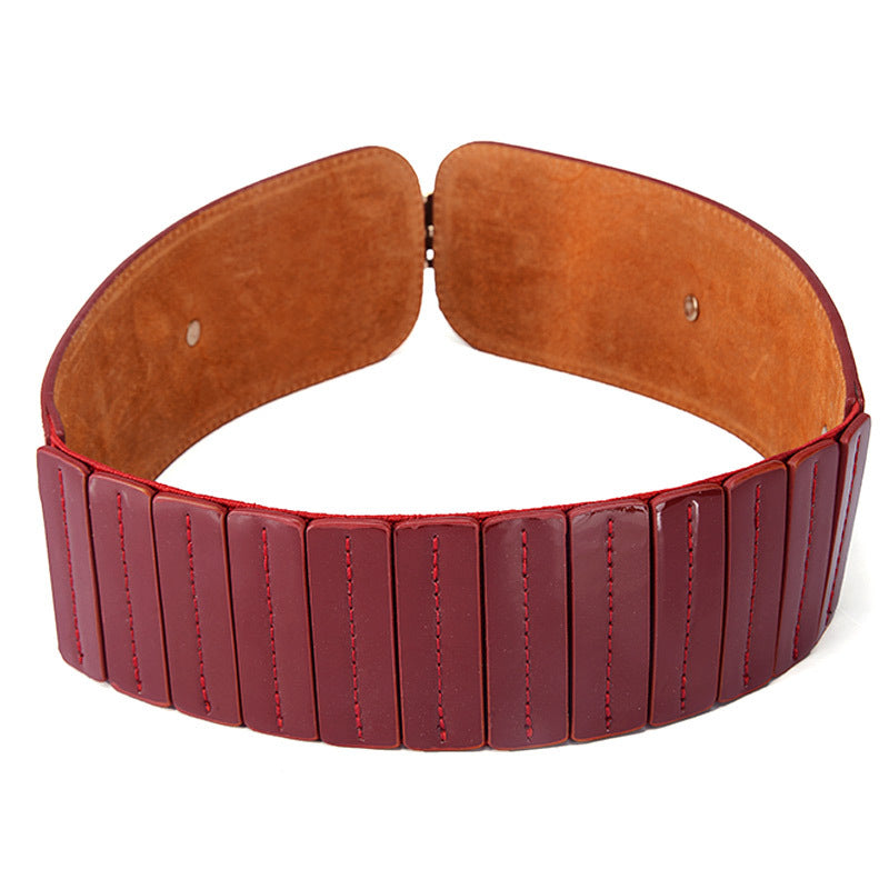Wide maroon leather belt with stitched panels, stylish accessory from FashionRay