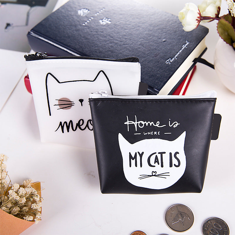 Cute cat-themed coin purses on desk with notebook, flowers, and scattered coins, FashionRay style