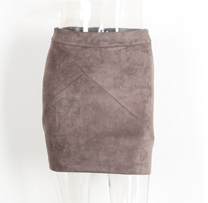 Taupe suede mini skirt with geometric seams on mannequin, FashionRay trendy women's fashion