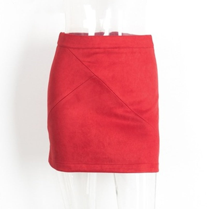 Red suede mini skirt with subtle diagonal seams on white mannequin, FashionRay trendy style