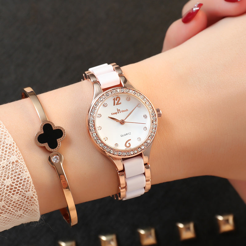 Elegant rose gold and white women's watch with rhinestone bezel and stylish bracelet from FashionRay