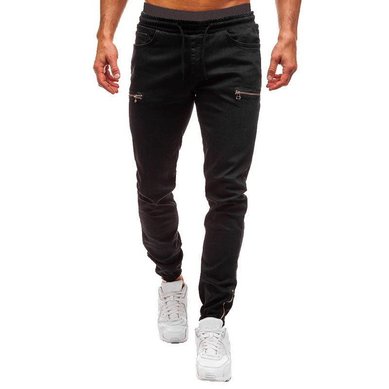 Men’s black jogger pants with zippered pockets, white sneakers, FashionRay casual style