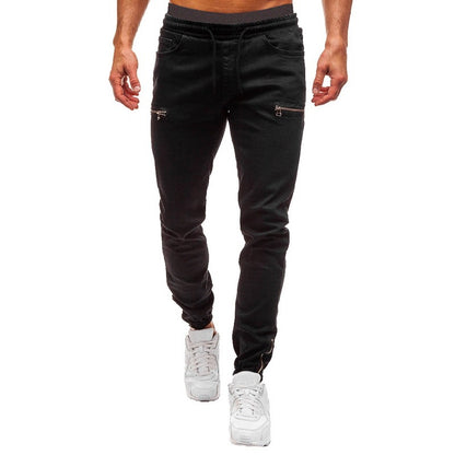 Men’s black jogger pants with zippered pockets, white sneakers, FashionRay casual style