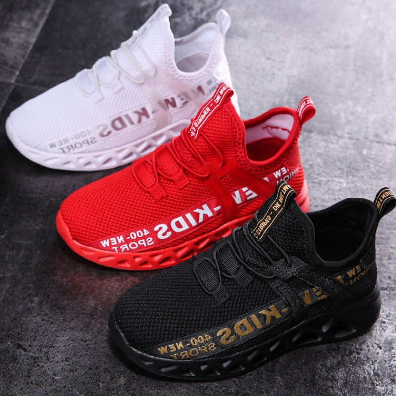 FashionRay kids' sporty sneakers in black, red, and white on a concrete surface
