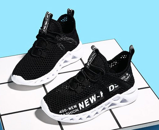 FashionRay black mesh sneakers with bold white soles and text design on a tiled surface