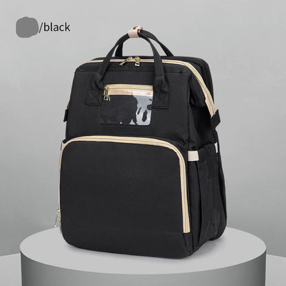 Black fashion backpack with beige zippers on a gray display, FashionRay accessory