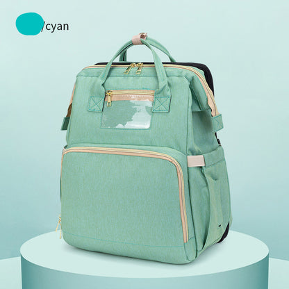 FashionRay cyan backpack with beige zippers, front pocket, and top handles on display pedestal