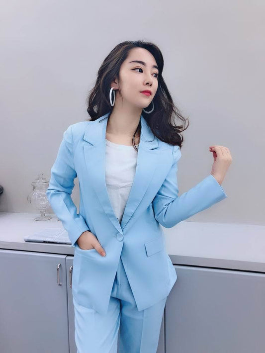 Woman in light blue suit and white top, stylish look for FashionRay trendy fashion