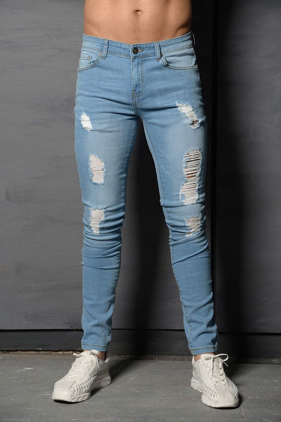 Trendy light blue ripped skinny jeans with white sneakers, FashionRay casual style