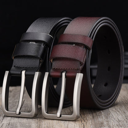 FashionRay classic black and brown leather belts with silver buckles on wood surface