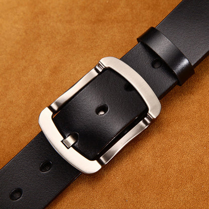 Black leather belt with silver buckle on brown suede background at FashionRay