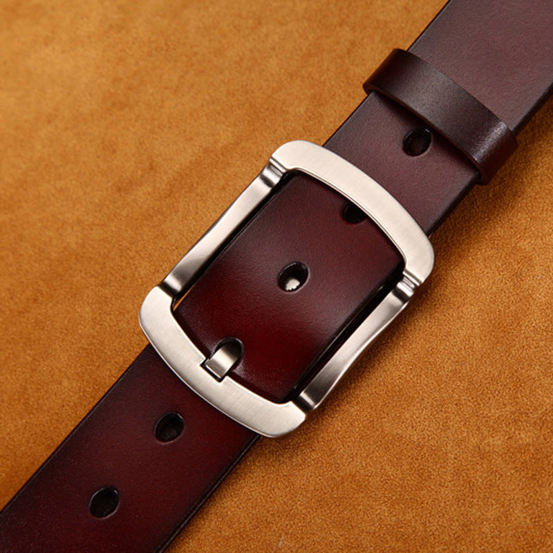 Classic brown leather belt with silver buckle on tan suede background, FashionRay accessory
